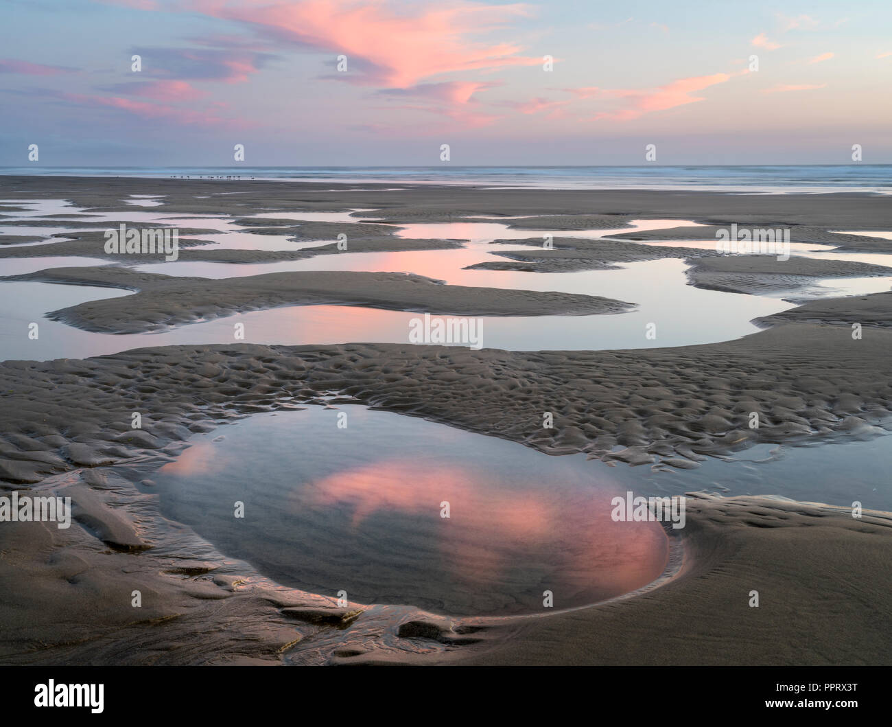 Manzanita, Oregon Tide pools reflecting sunset sky, Manzanita beach