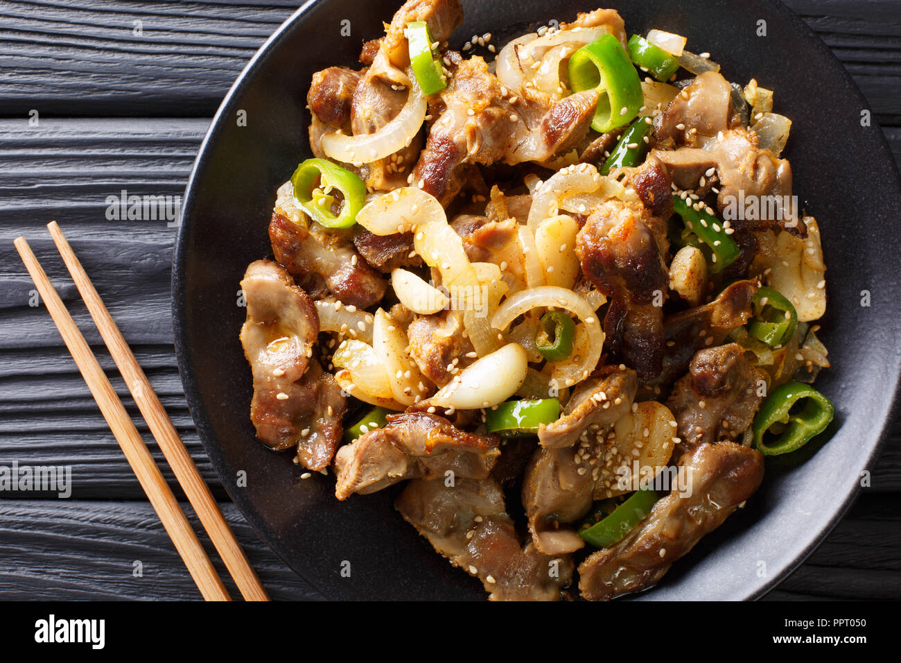 Traditional Korean spicy chicken gizzard with onions, garlic, chili and