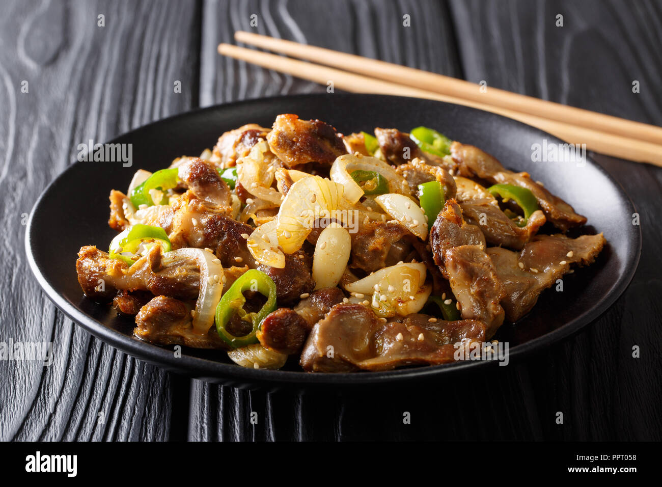 South Korean fried chicken gizzard with jalapeno pepper, onion, garlic