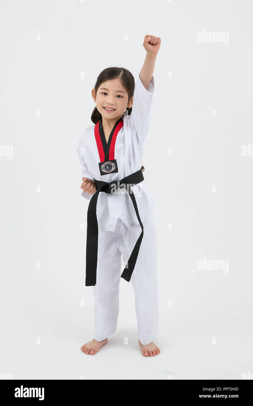 elefante argumento Lucro Children education. Taekwondo, little boy and girl practice martial arts in  white background 252 Stock Photo - Alamy