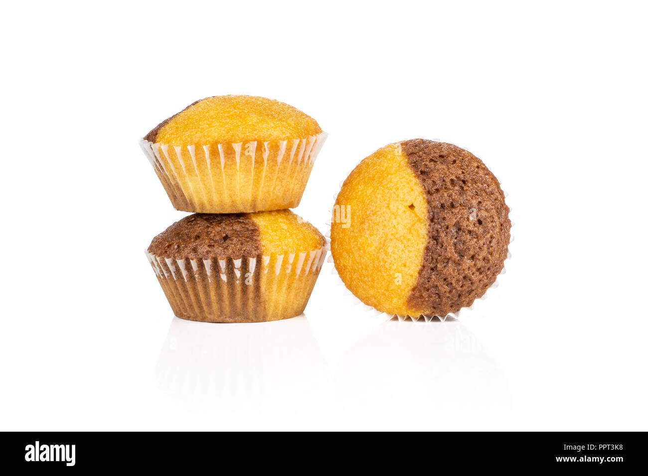 Group of three whole fresh baked marble muffin isolated on white background Stock Photo