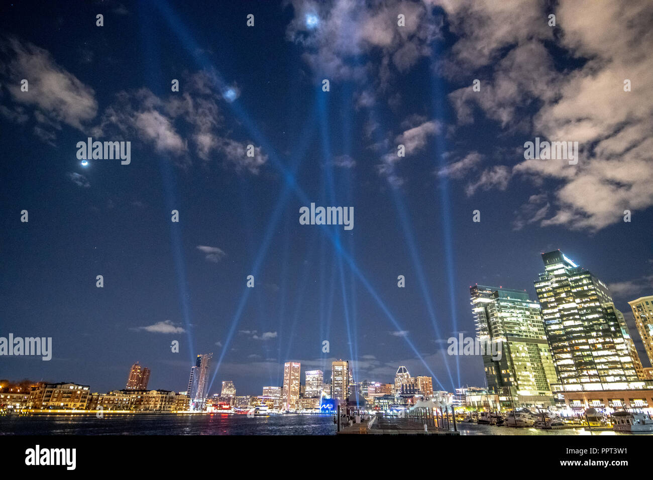 The Baltimore harbor lit up for Light City while search lights draw  attraction to the event. Baltimore, MD Stock Photo - Alamy