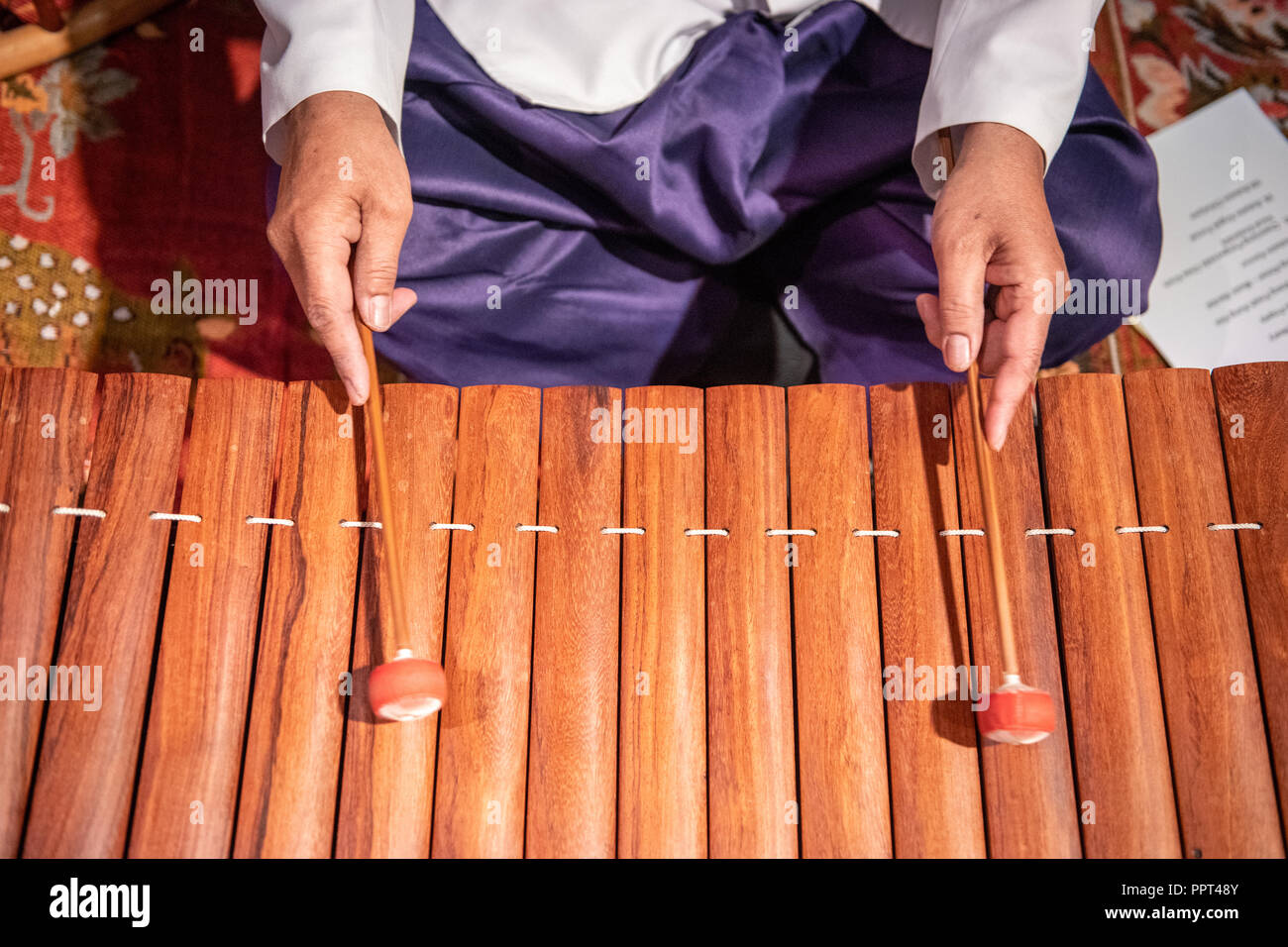 A man plays the Roneat Aek (Bamboo / wooden xylophone)  at a Cambodian New Year festival in Virginia Stock Photo