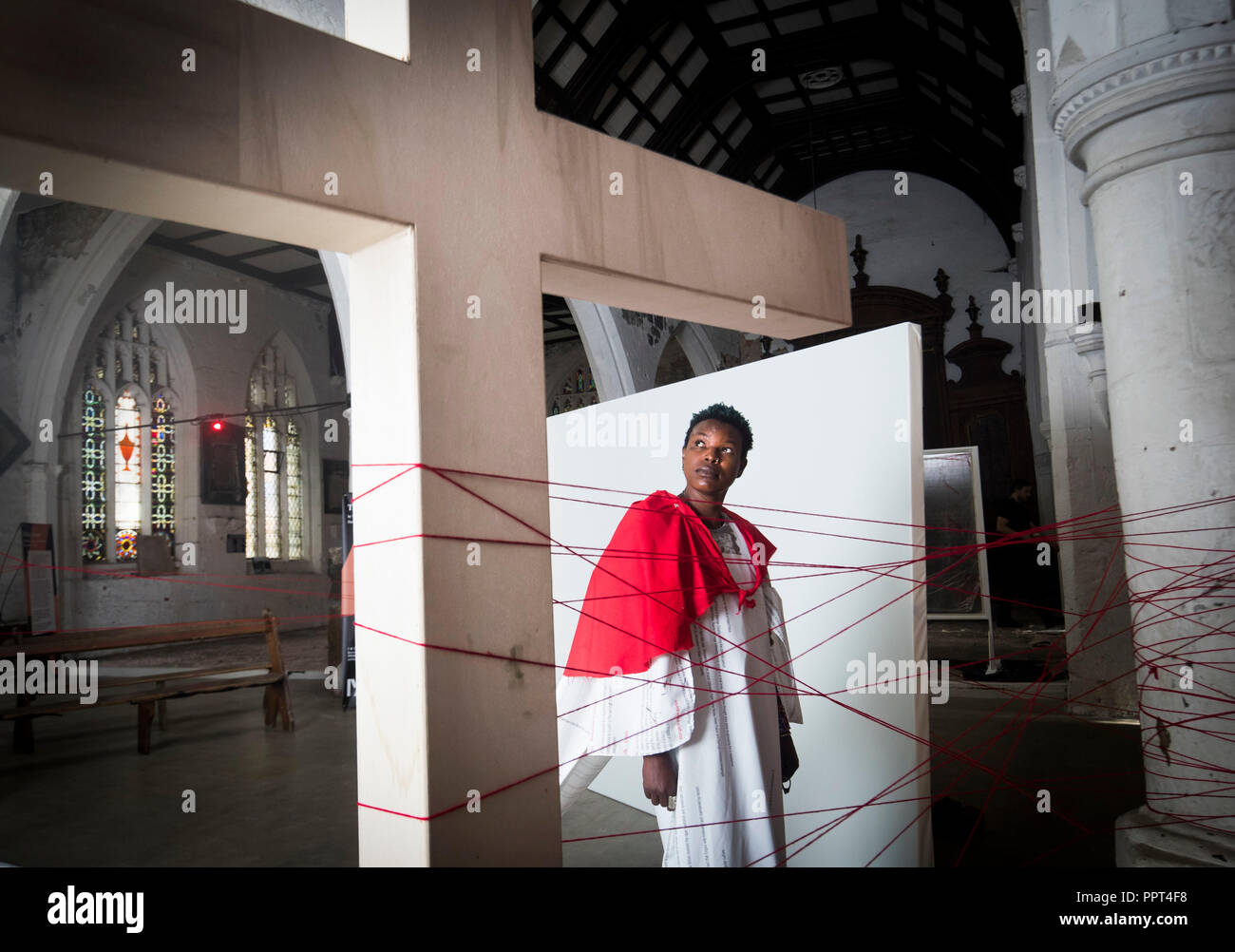 Artist Neo Sinoxolo Musangi with her installation titled The Way of the Cross at the Stained Glass Centre in York ahead of York Mediale, a new international media art festival which aims to bring world premiere commissions from leading artists to the city and provide a new platform for emerging talent to showcase their art. Stock Photo