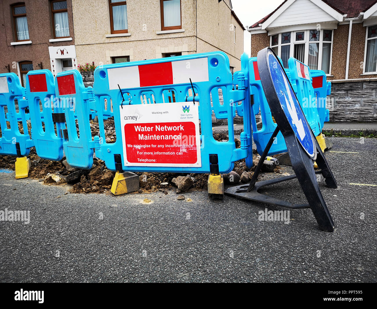 Swansea, UK: August, 2018: Welsh Water maintenance cause an obstruction in the road. Dŵr Cymru Welsh Water is a company which supplies drinking water. Stock Photo