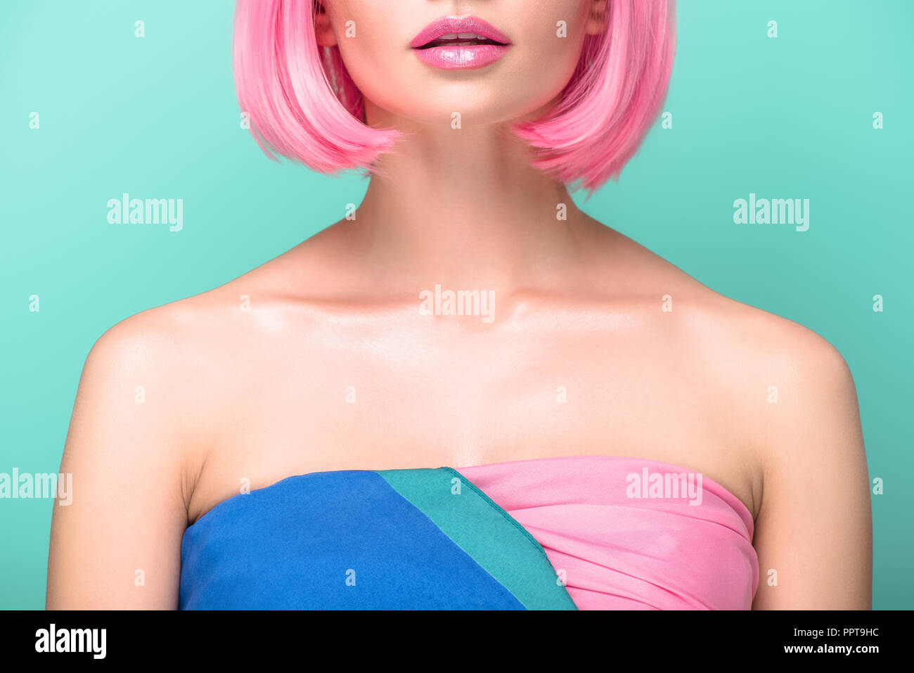 cropped shot of young woman with pink bob cut isolated on ...