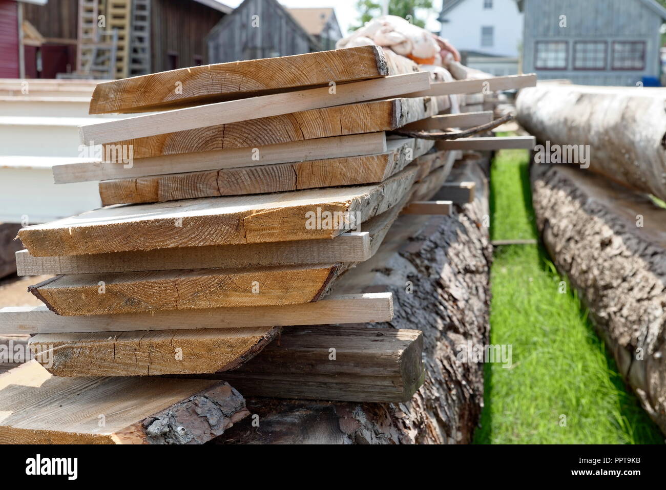 Fresh sawn wooden planks for custom boat building. Stock Photo