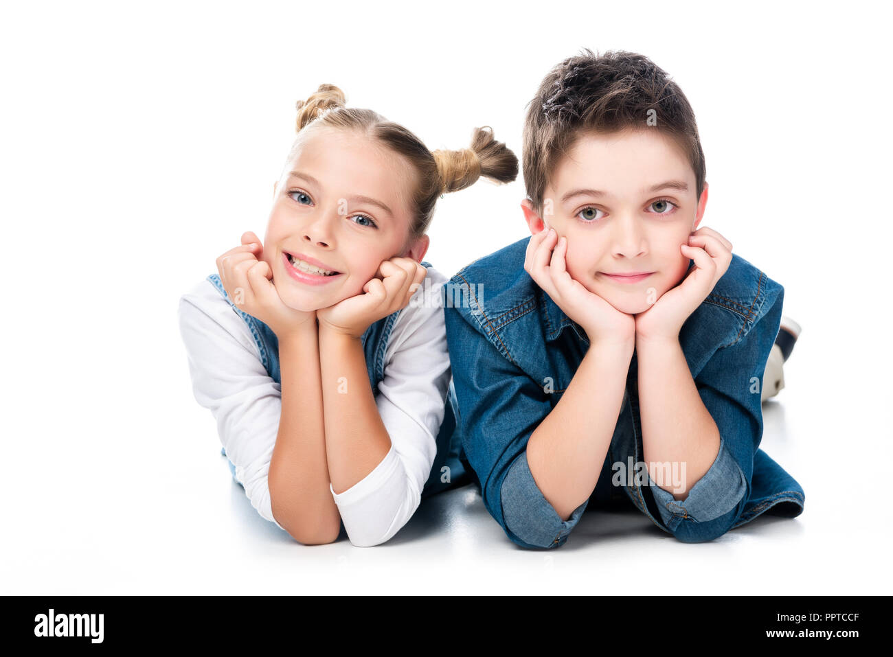 two classmates resting chins on hands isolated on white Stock Photo