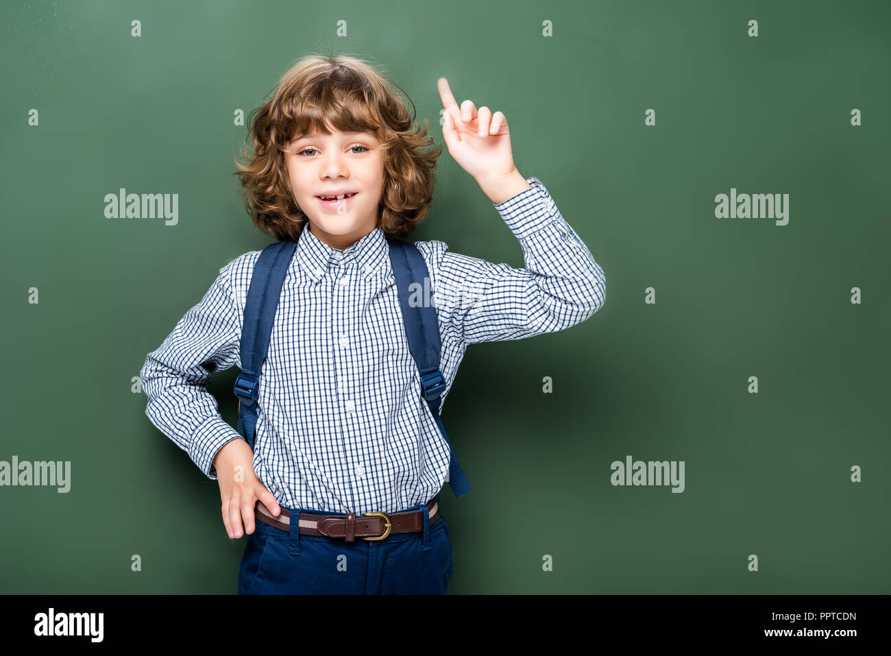 schoolboy showing idea gesture near blackboard Stock Photo - Alamy