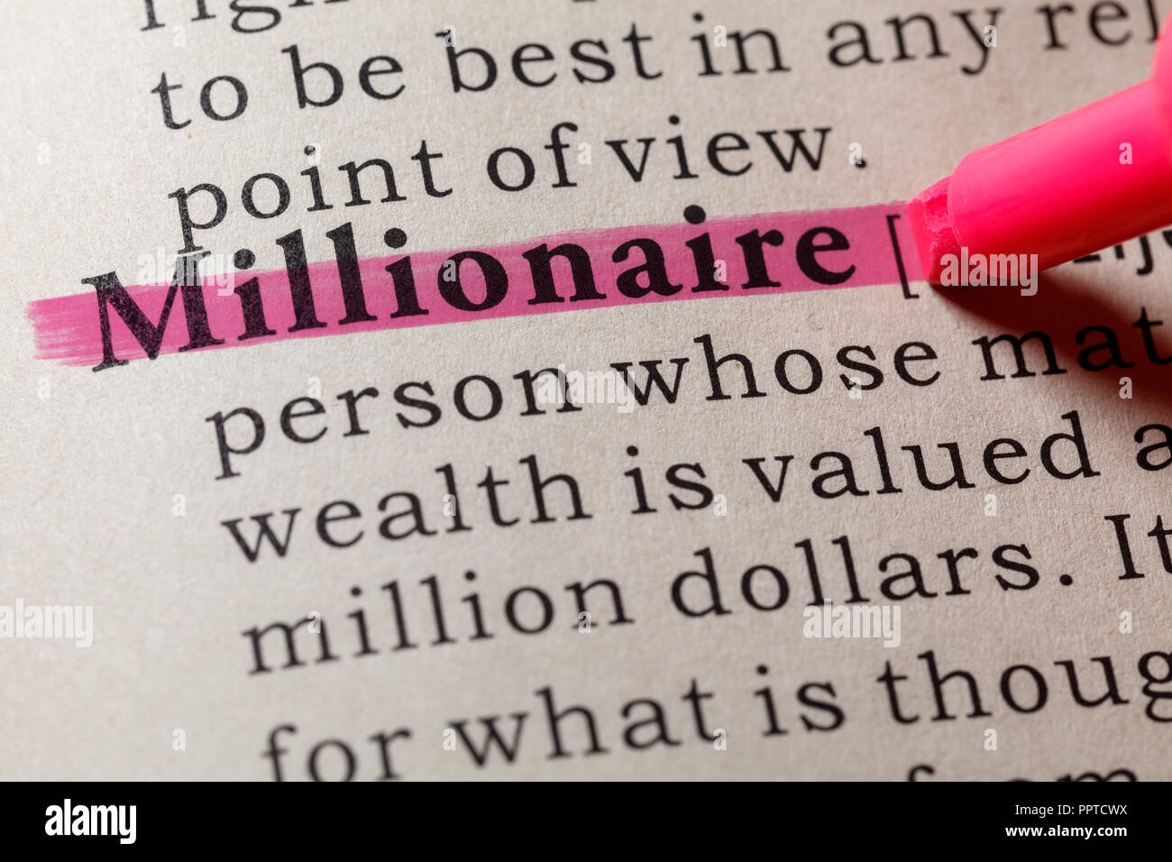 Fake Dictionary, Dictionary definition of the word Millionaire. including key descriptive words. Stock Photo