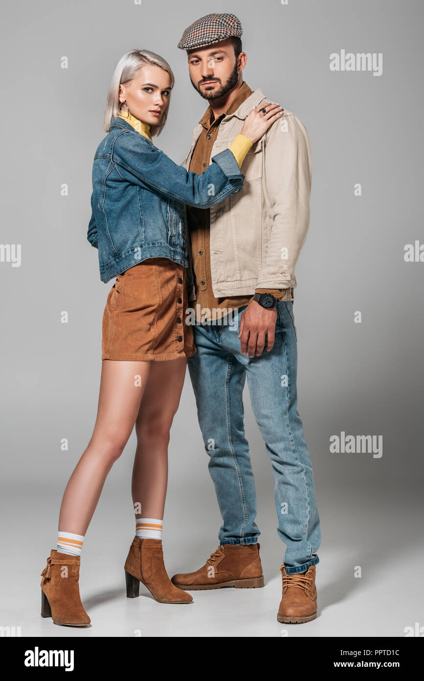 young couple standing together posing in studio white background Stock  Photo - Alamy