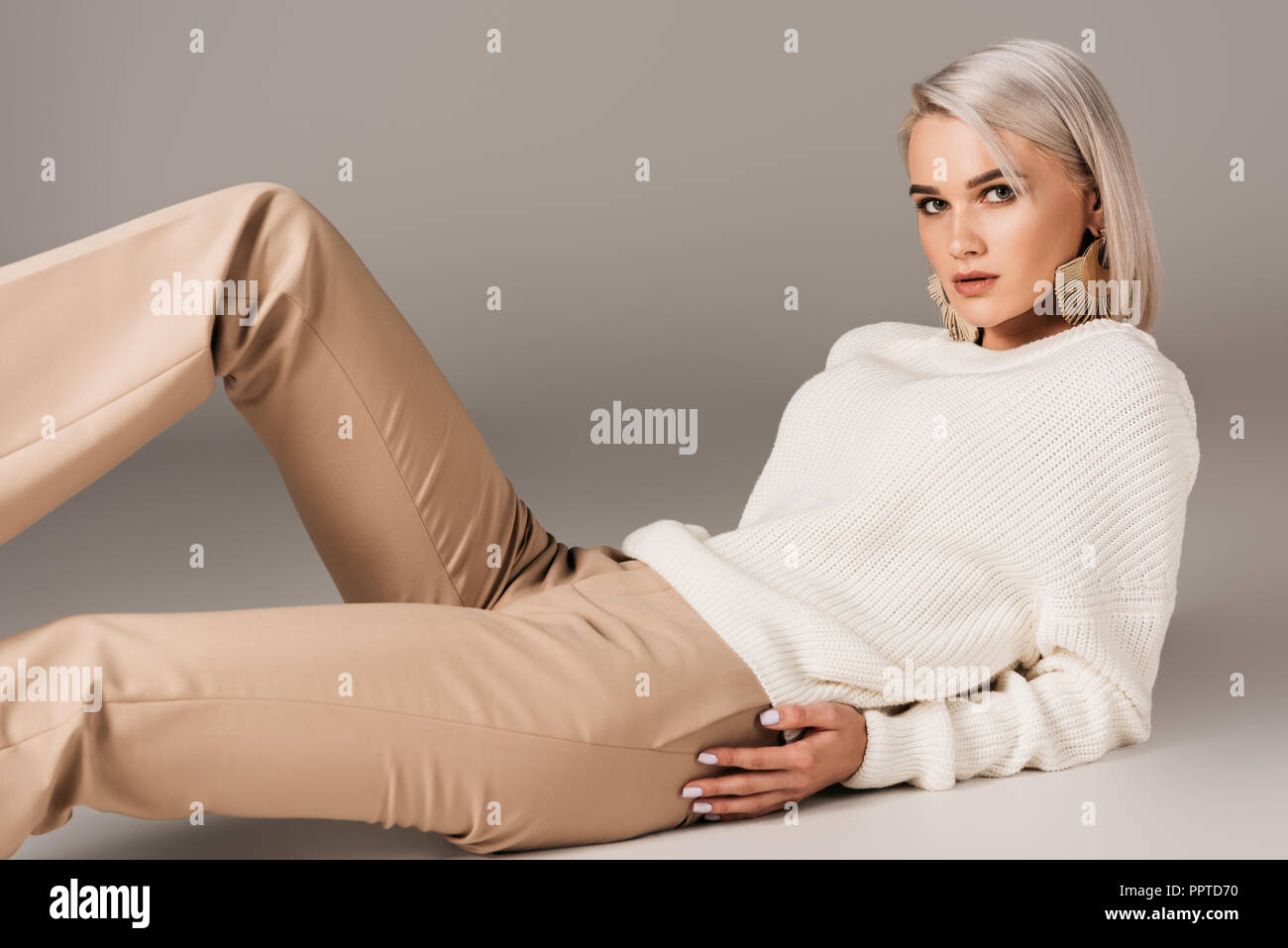 white sweater grey pants