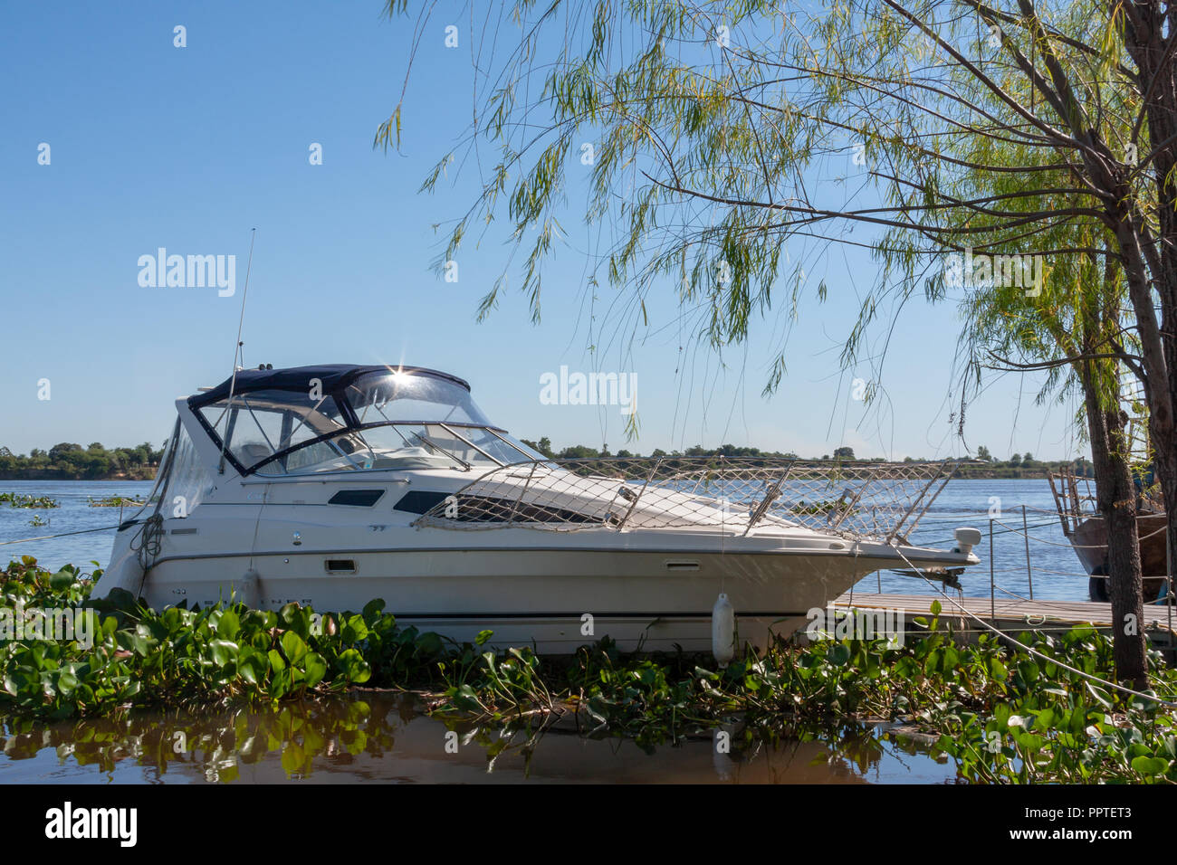 Boat at riverside, Rio (River) Paraguay on the background, Mariano Roque Alonso, Central Department, Paraguay Stock Photo
