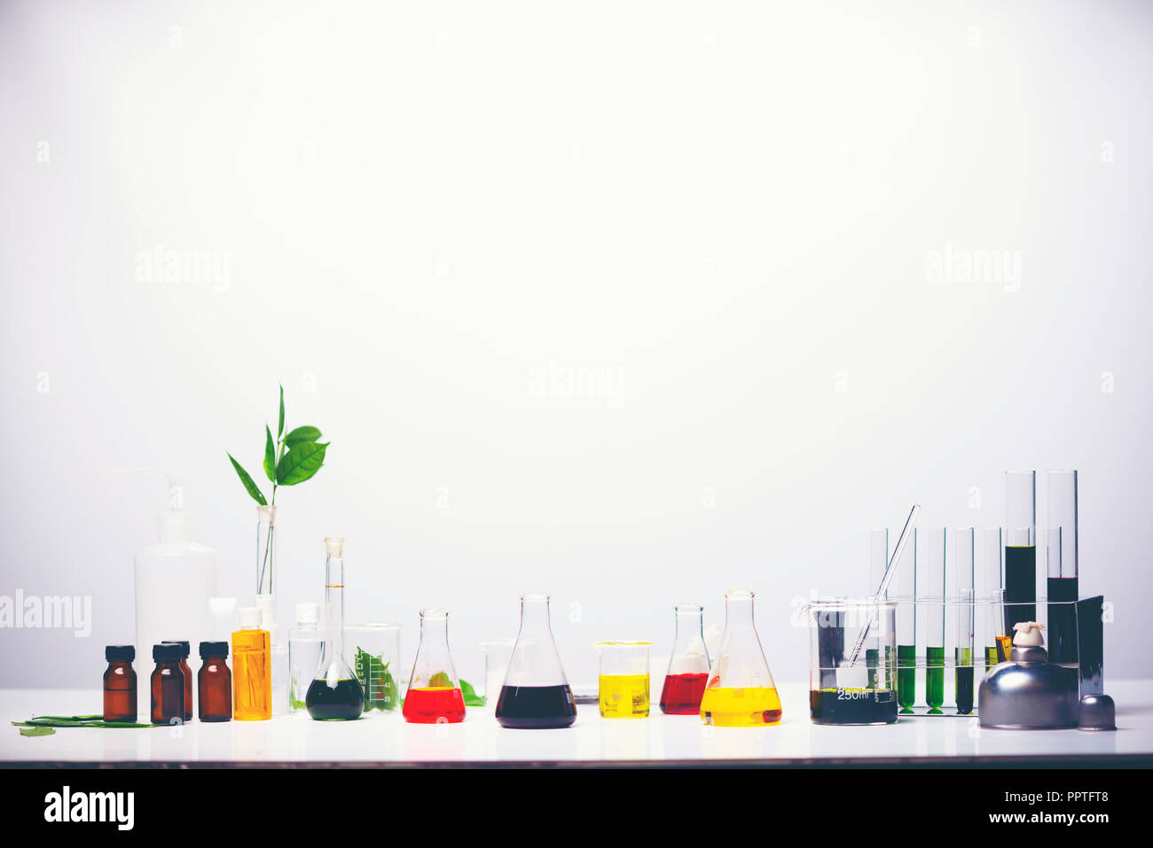 Lab equipment, glassware kit filled with various colored liquids and