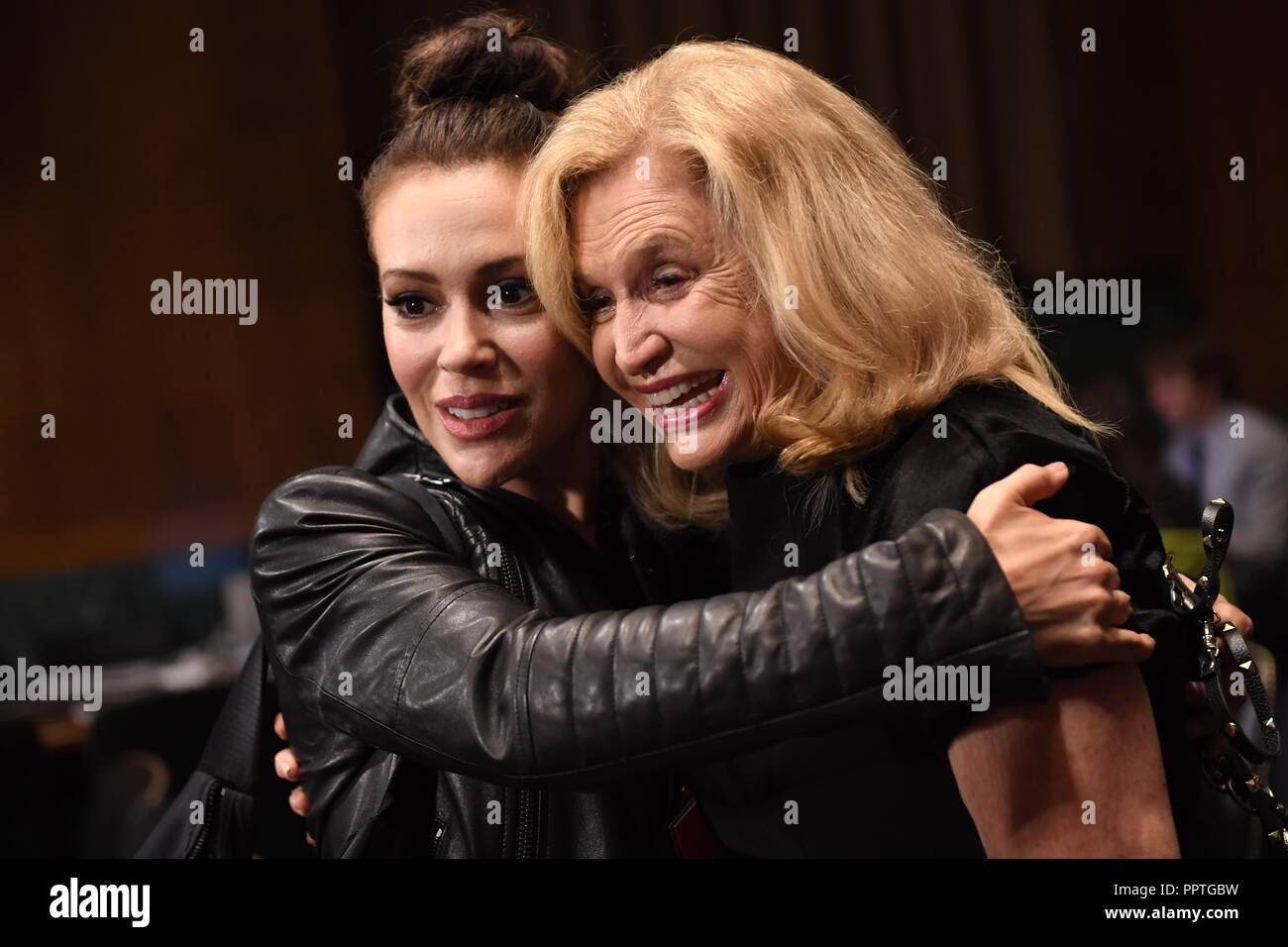 UNITED STATES - SEPTEMBER 27: Actress Alyssa Milano, left, hugs Rep. Carolyn Maloney, D-N.Y., in the hearing room before the start of Dr. Christine Blasey Ford's appearance in the Senate Judiciary Committee to testify on the nomination of Brett M. Kavanaugh to be an associate justice of the Supreme Court of the United States. (Photo By Tom Williams/CQ Roll Call) | usage worldwide Stock Photo
