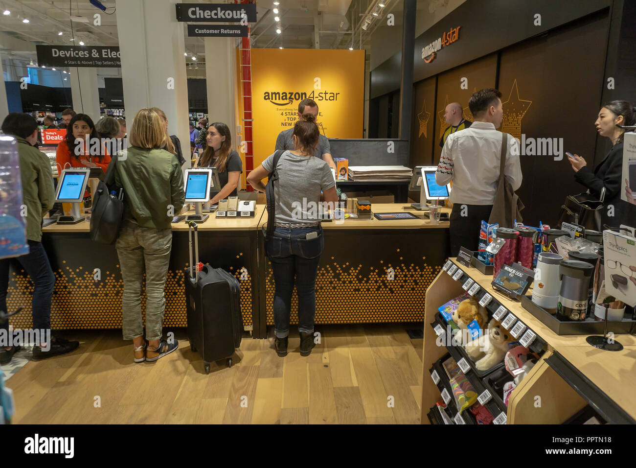 New York, USA. 27th Sept 2018. Customers shop and browse in the new Amazon 4-star store in the Soho shopping district in New York on opening day, Thursday, September 27, 2018.  The store sells a potpourri of goods from toys, to kitchen gadgets, to books, to electronics with all of them receiving at least a four star rating on Amazon. Credit: Richard Levine/Alamy Live News Stock Photo