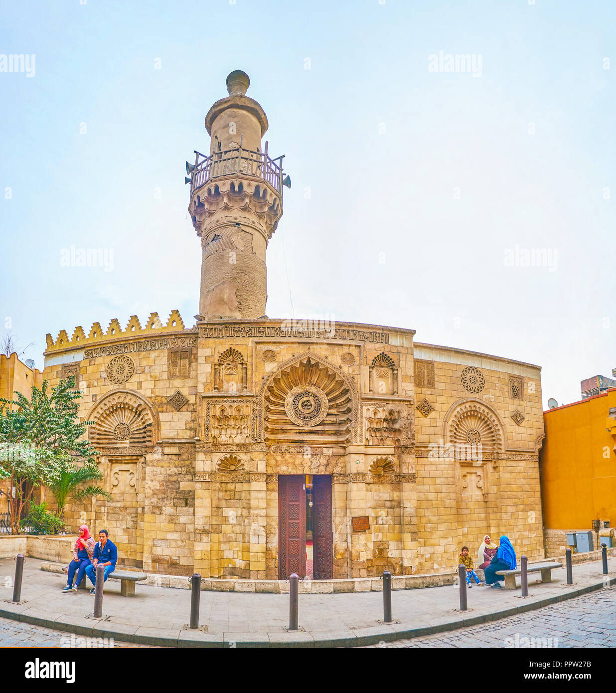 CAIRO, EGYPT - DECEMBER 23, 2017: The medieval Aqmar Mosque with shabby minaret is also called the Grey Mosque, located on Al-Muizz street in Islamic  Stock Photo