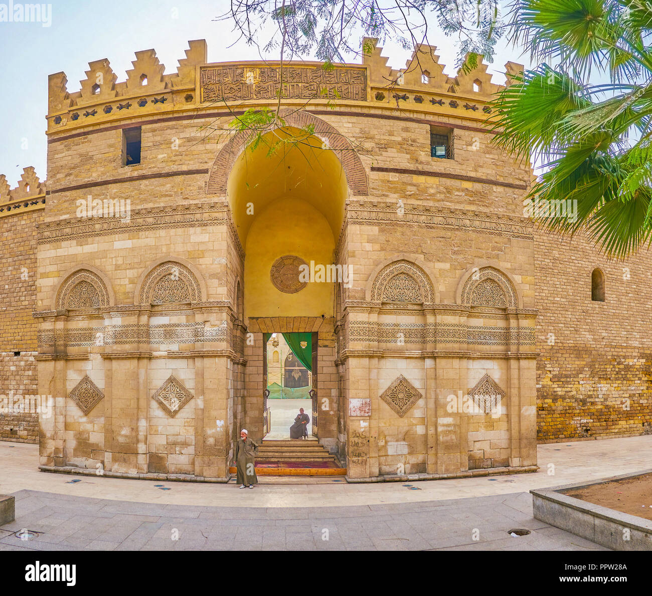 CAIRO, EGYPT - DECEMBER 23, 2017: The huge gatehouse of Al-Hakim Mosque opens the way to the large courtyard, on December 23 in Cairo Stock Photo