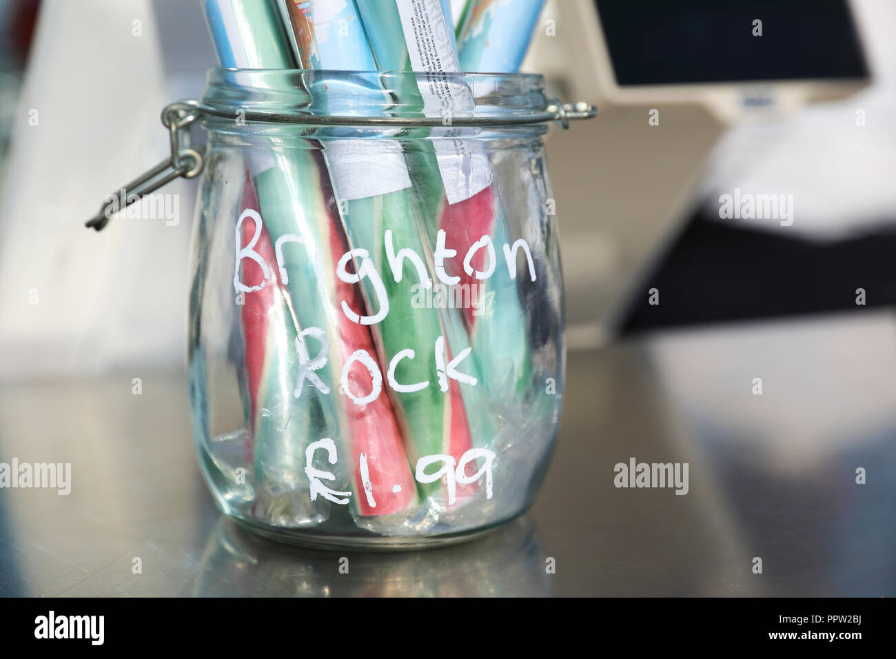 Sticks of iconic rock for sale at the bar in the glass viewing pod on the Brighton i360, on the seafront, in East Sussex, in the UK Stock Photo