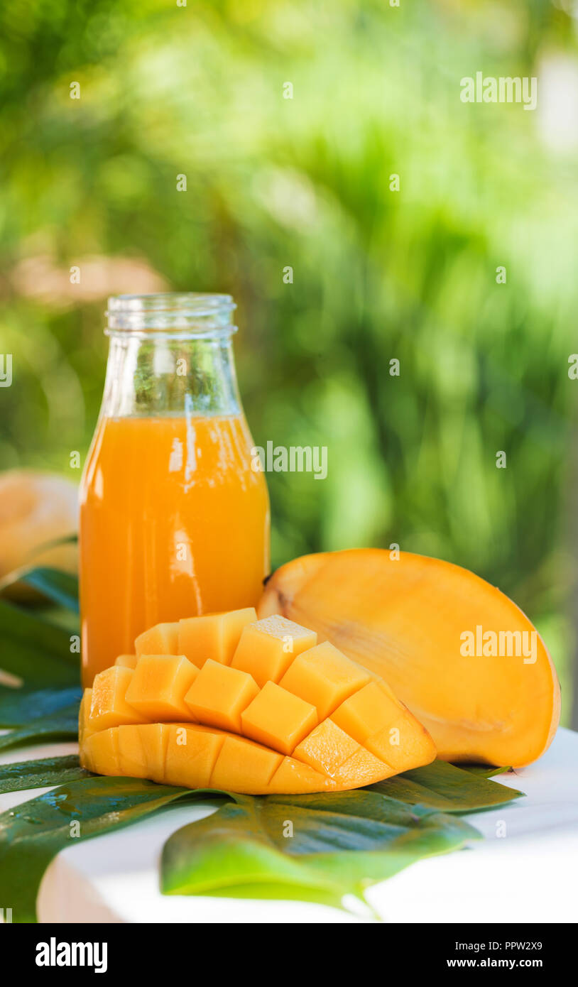 Fresh mango juice in the bottle outdoors Stock Photo Alamy