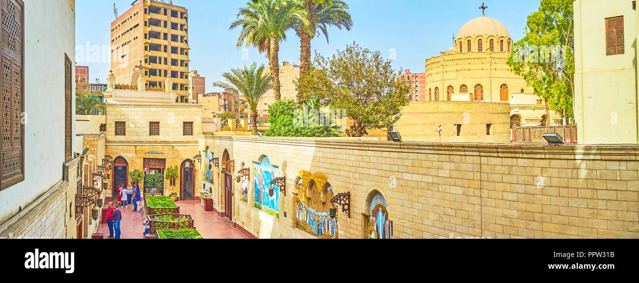 CAIRO, EGYPT - DECEMBER 23, 2017: The view on historical christian Coptic neighborhood with huge churches and courtyards with icons, on December 23 in Stock Photo