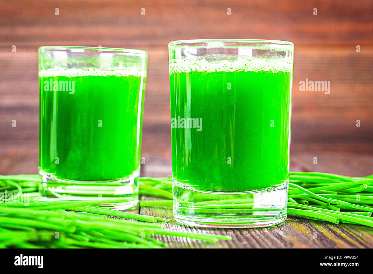 Wheatgrass shot. Juice from wheat grass. Trend of health Stock Photo
