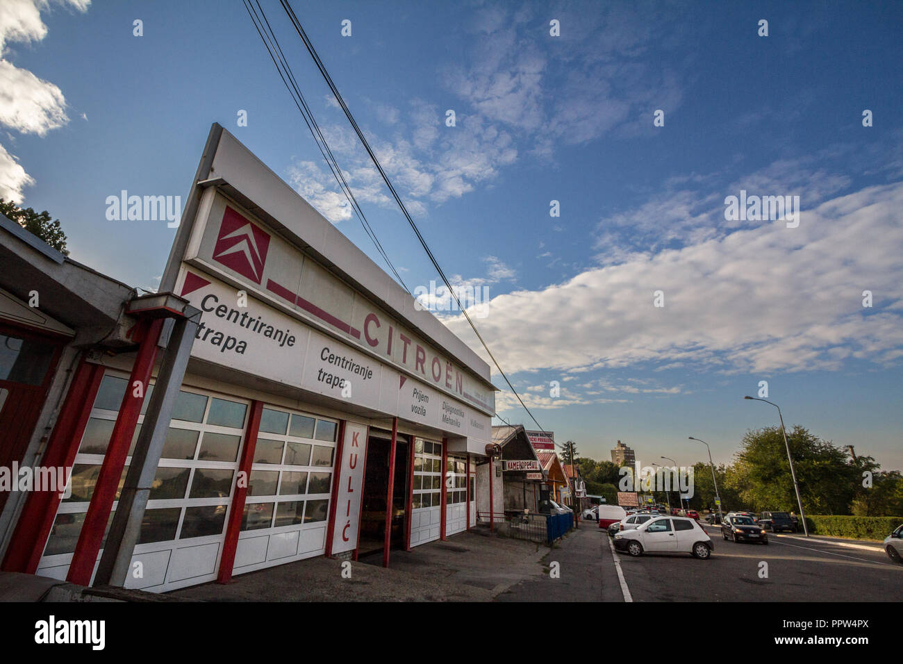 PANCEVO, SERBIA - SEPTEMBER 27, 2018: Citroen logo on an sign of a car dealership and garage of the brand. Citroen, part of PSA group, is one of main  Stock Photo