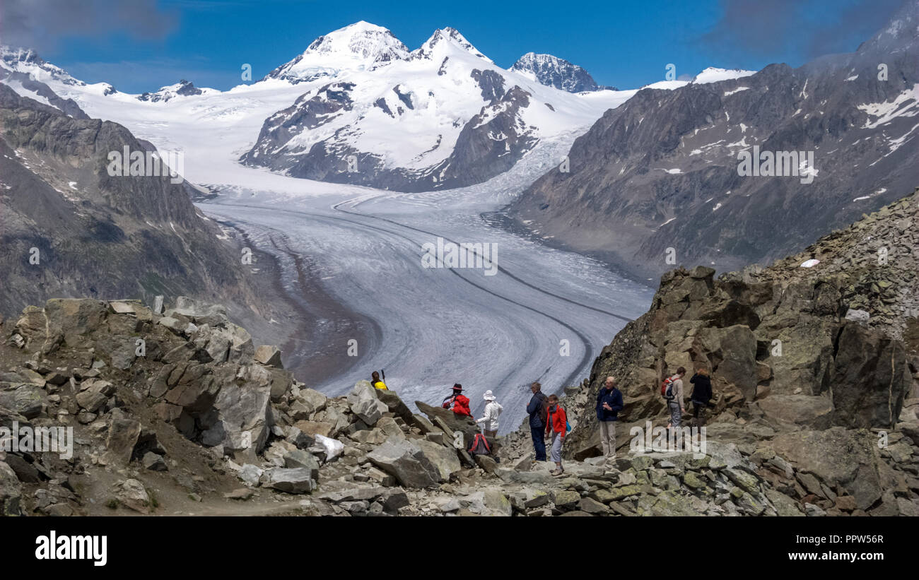 Aletsch Glacier, Switzerland – June 24, 2011: Tourists have come to see the Great Aletsch Glacier. It is the largest glacier in the Alps Stock Photo