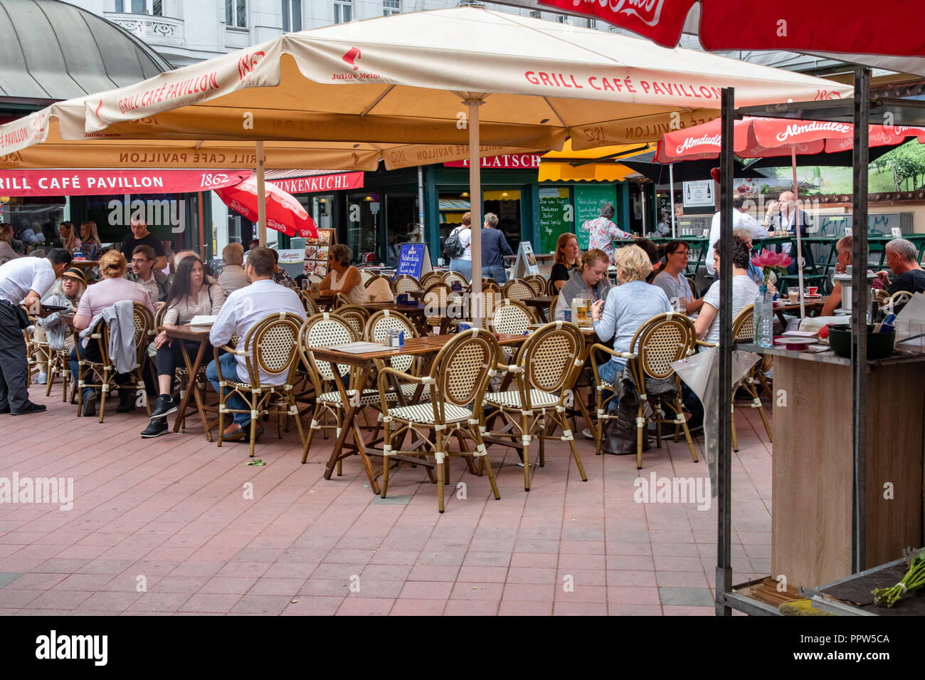 Viennese sidewalk cafe at the market square in Vienna, Austria Stock Photo