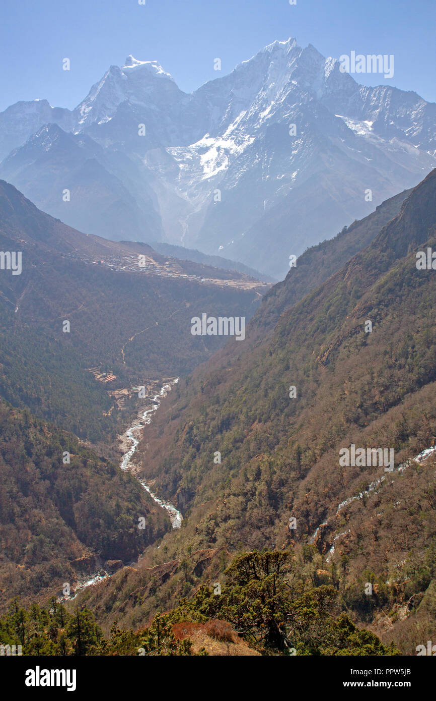 View through the Gokyo valley to Phortse village and Thamserku mountain Stock Photo