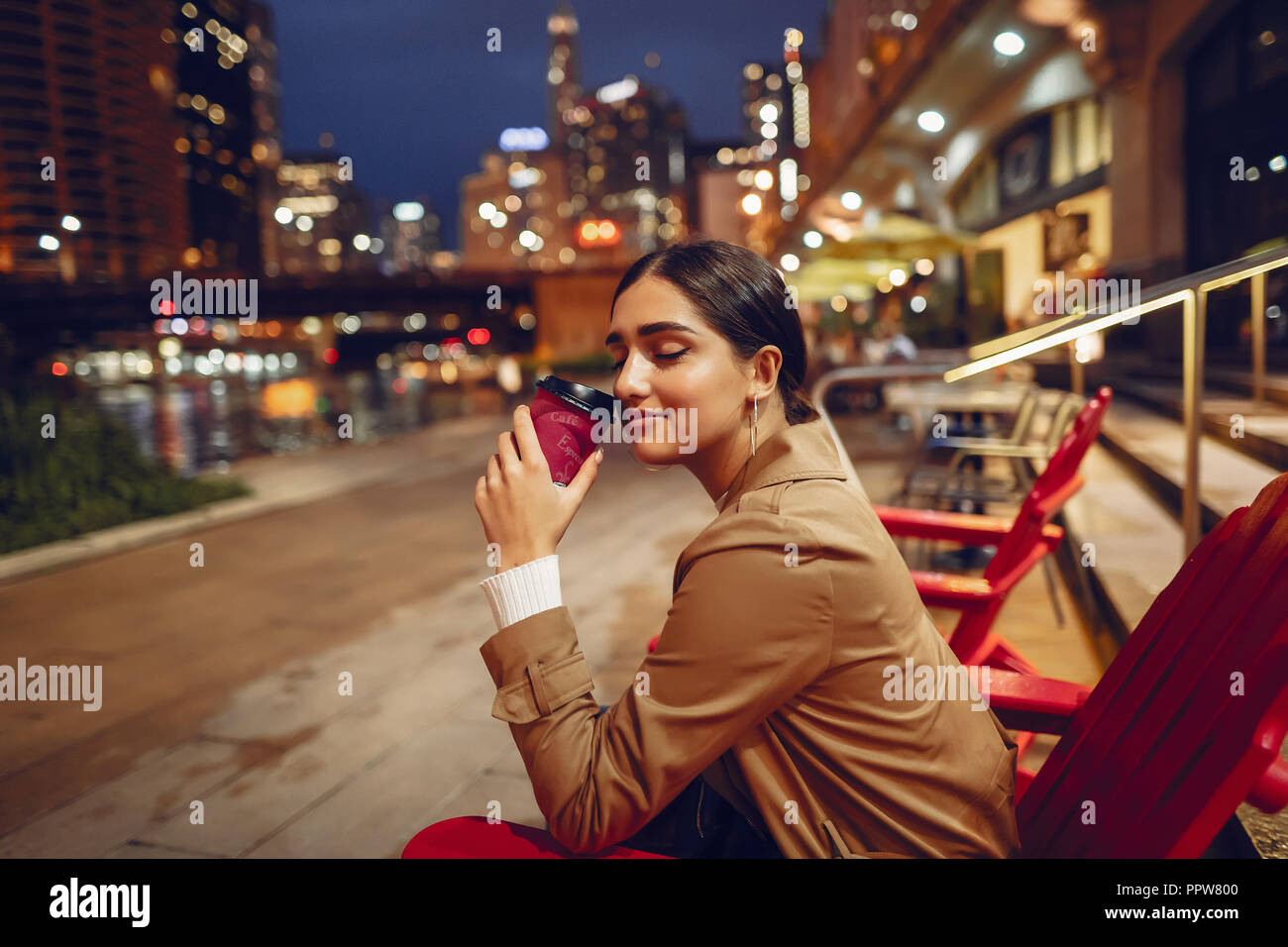 woman drinking coffee at night Stock Photo Alamy