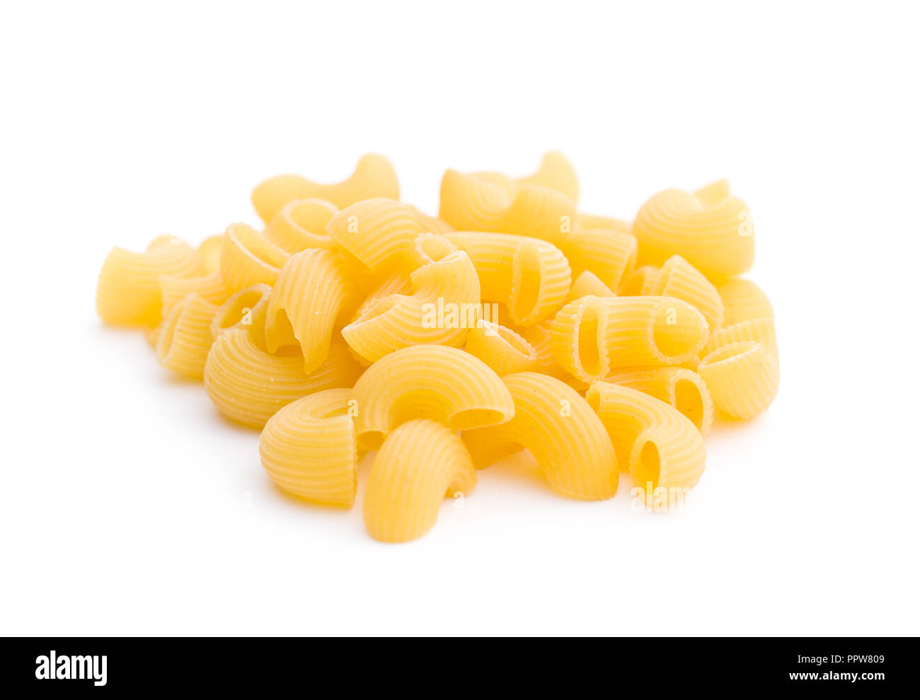 Uncooked elbow macaroni isolated on white background Stock Photo Alamy