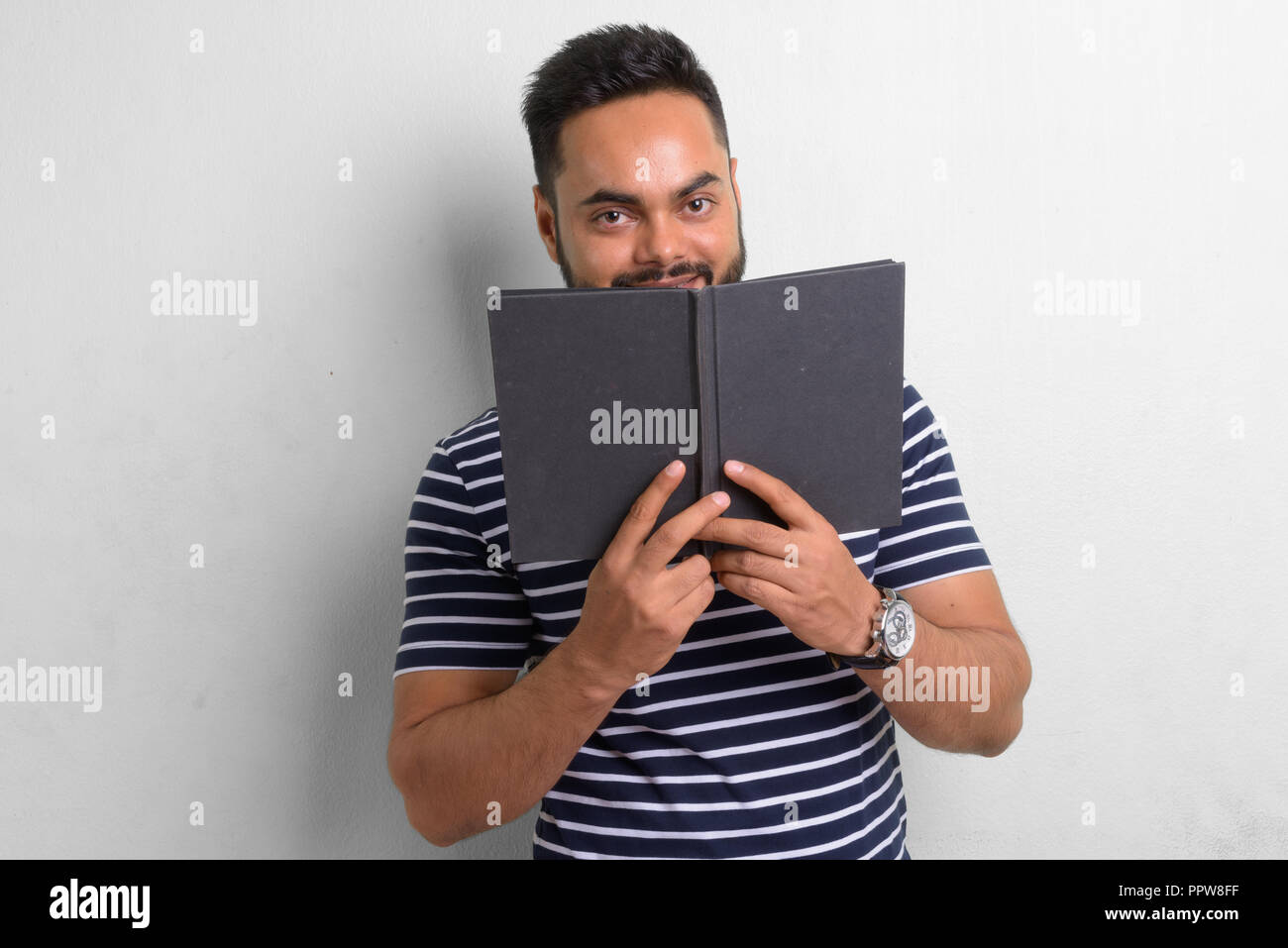 Young indian man hiding hi-res stock photography and images - Alamy