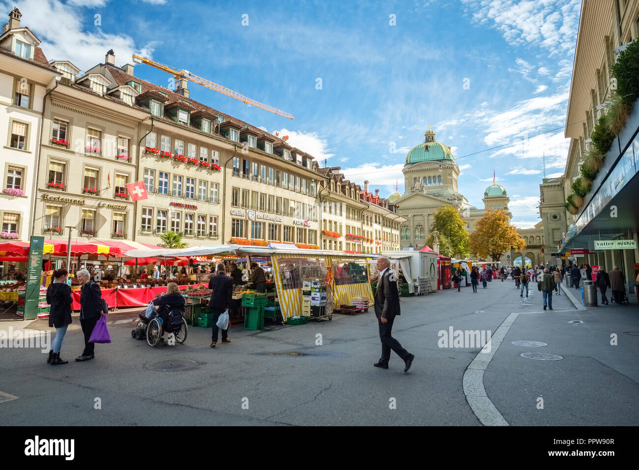Bern, Switzerland - September 16, 2015: Photo taken at the Barenplatz in Bern, Switzerland. We look towards the Bundesplatz in the back Stock Photo