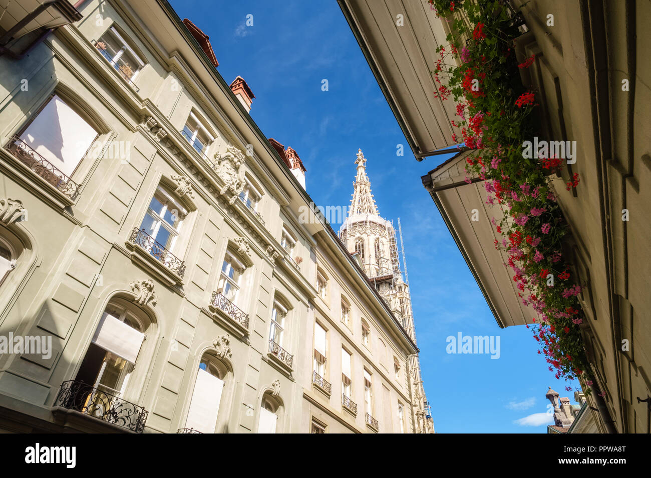 Bern, Switzerland - September 16, 2015: The famous Munster Cathedral towering over streets and houses in Bern. It is the highest tower of Switzerland Stock Photo