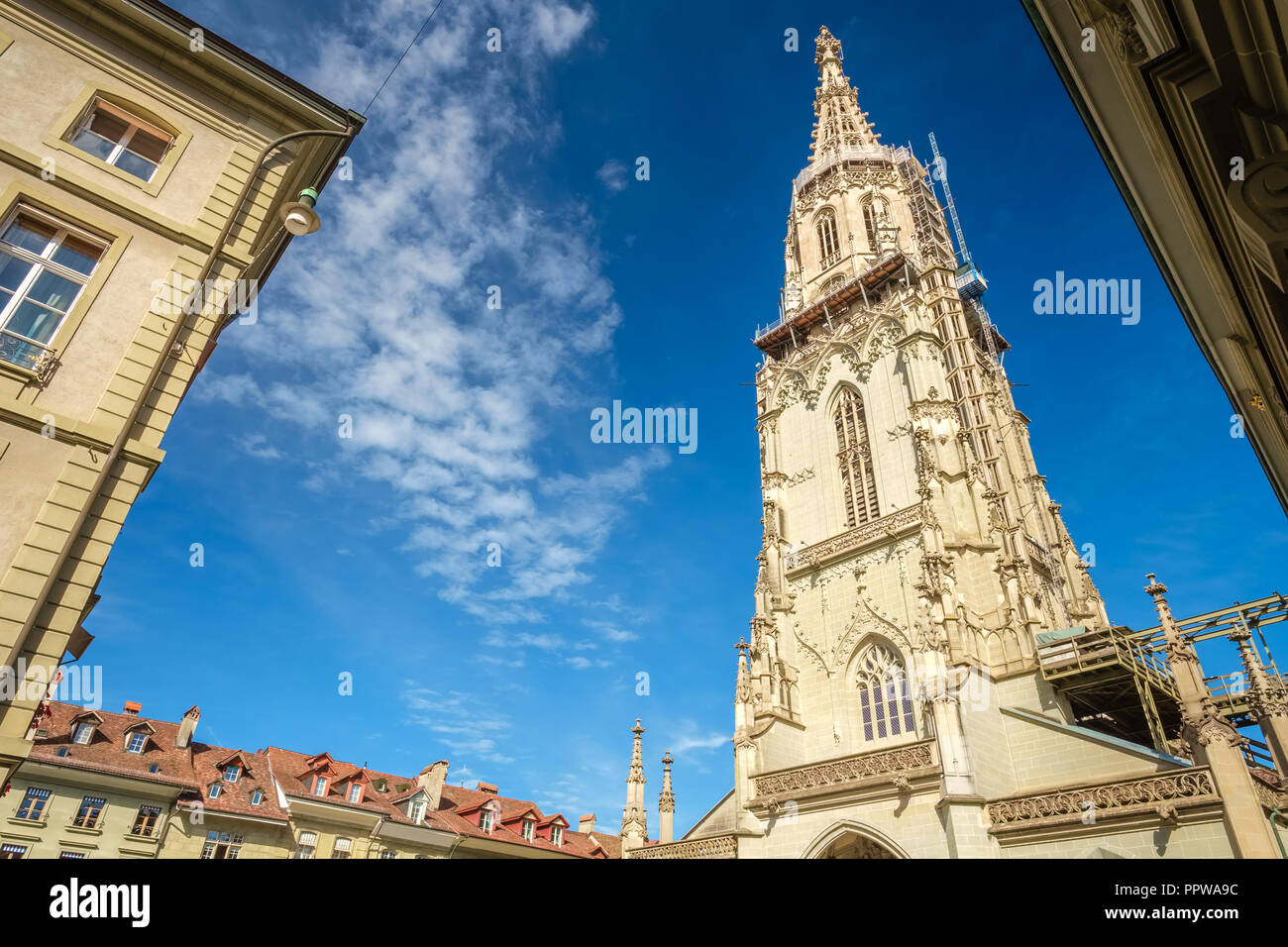 Bern, Switzerland - September 16, 2015: The famous Munster Cathedral towering over streets and houses in Bern. It is the highest tower of Switzerland Stock Photo