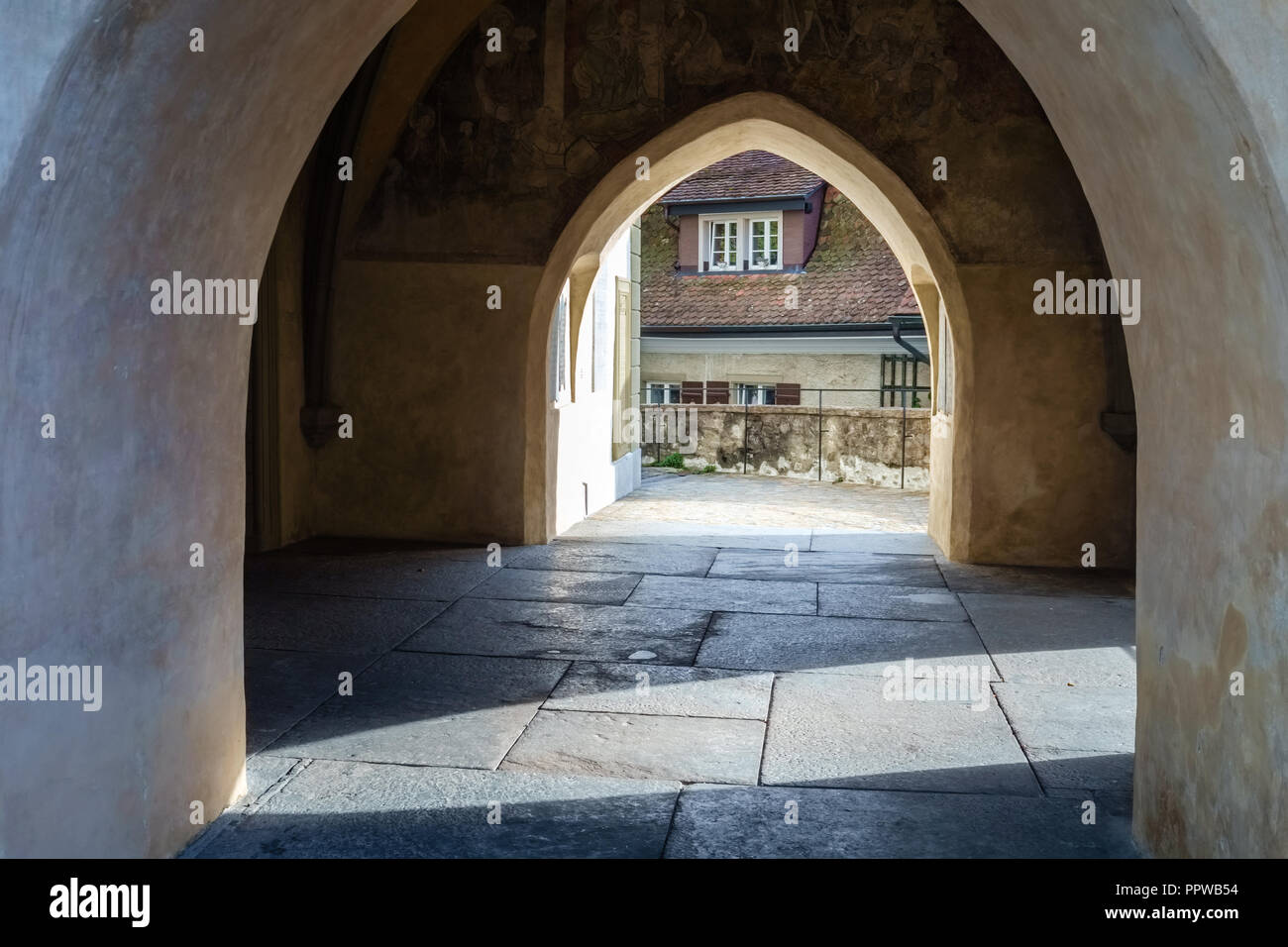The entrance of the City Church Thun (Switzerland) which is located near the Castle of Thun. It is defined by its medieval tower and baroque aisle Stock Photo