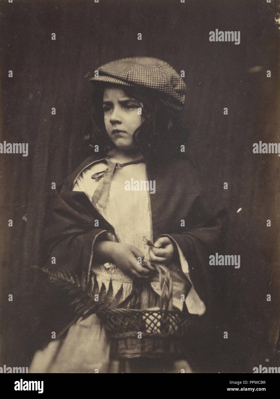 Young Girl Holding a Basket; Lewis Carroll, British, 1832 - 1898, July 5, 1876; Albumen silver print Stock Photo