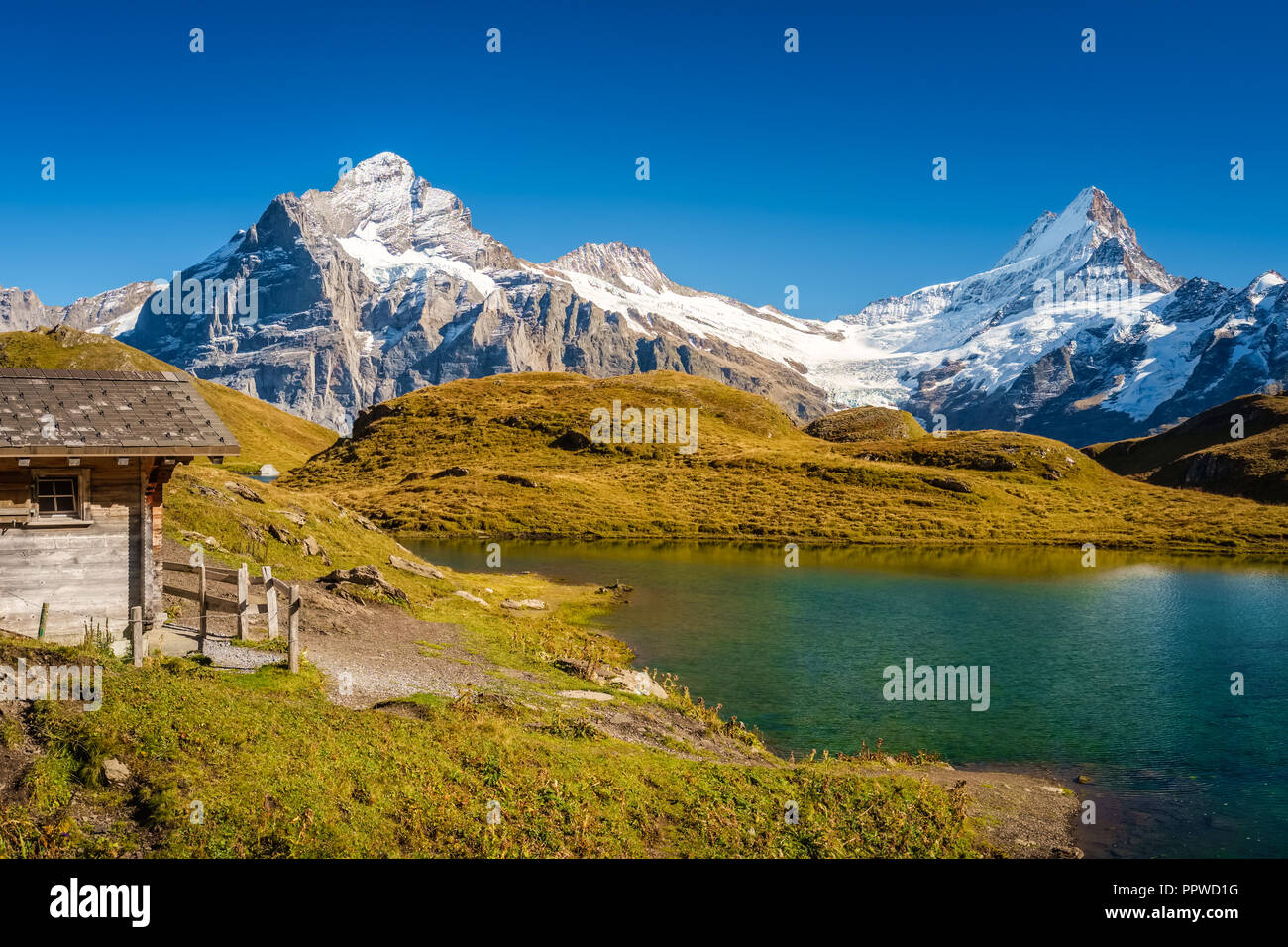 Encountering Bachalpsee during the famous hiking trail from First to Grindelwald (Bernese Alps, Switzerland). Stock Photo