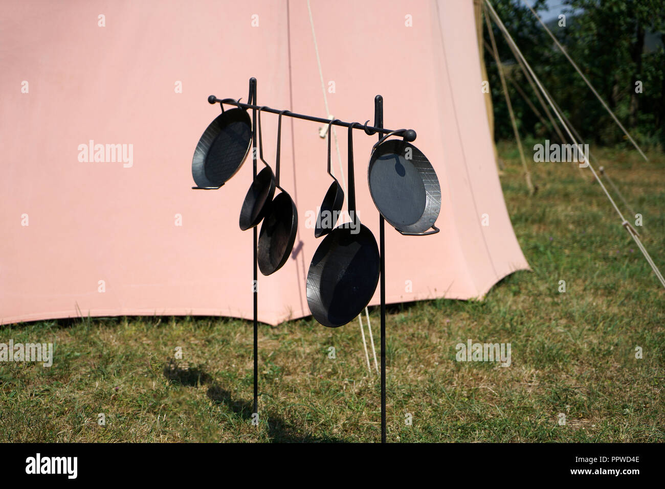 Primitive cooking on open flame with old pots and pans in Germany on a