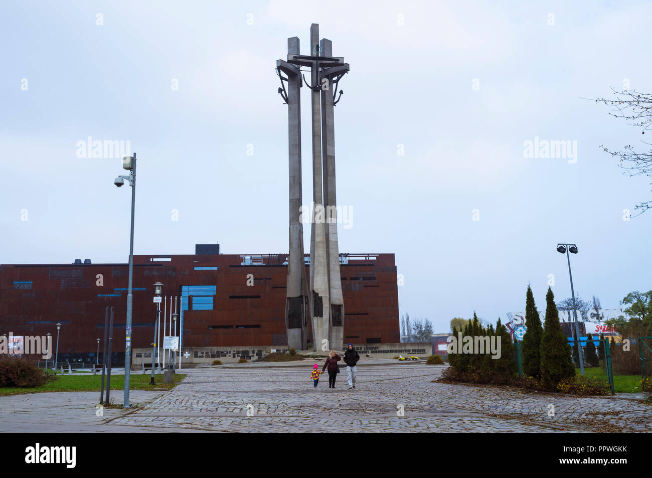 Gdansk, Pomerania, Poland : People walk through Solidarity Square. In background, the European Solidarity Centre (opened 2014) next to the entrance to Stock Photo