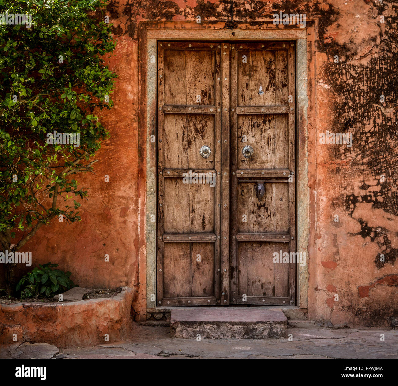Old wooden door red wall at Jaigarh Fort, Jaipur Stock Photo Alamy