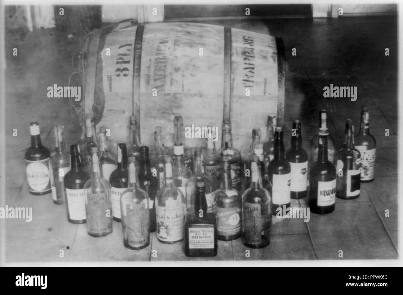 Bottles and barrel of confiscated whiskey Stock Photo Alamy