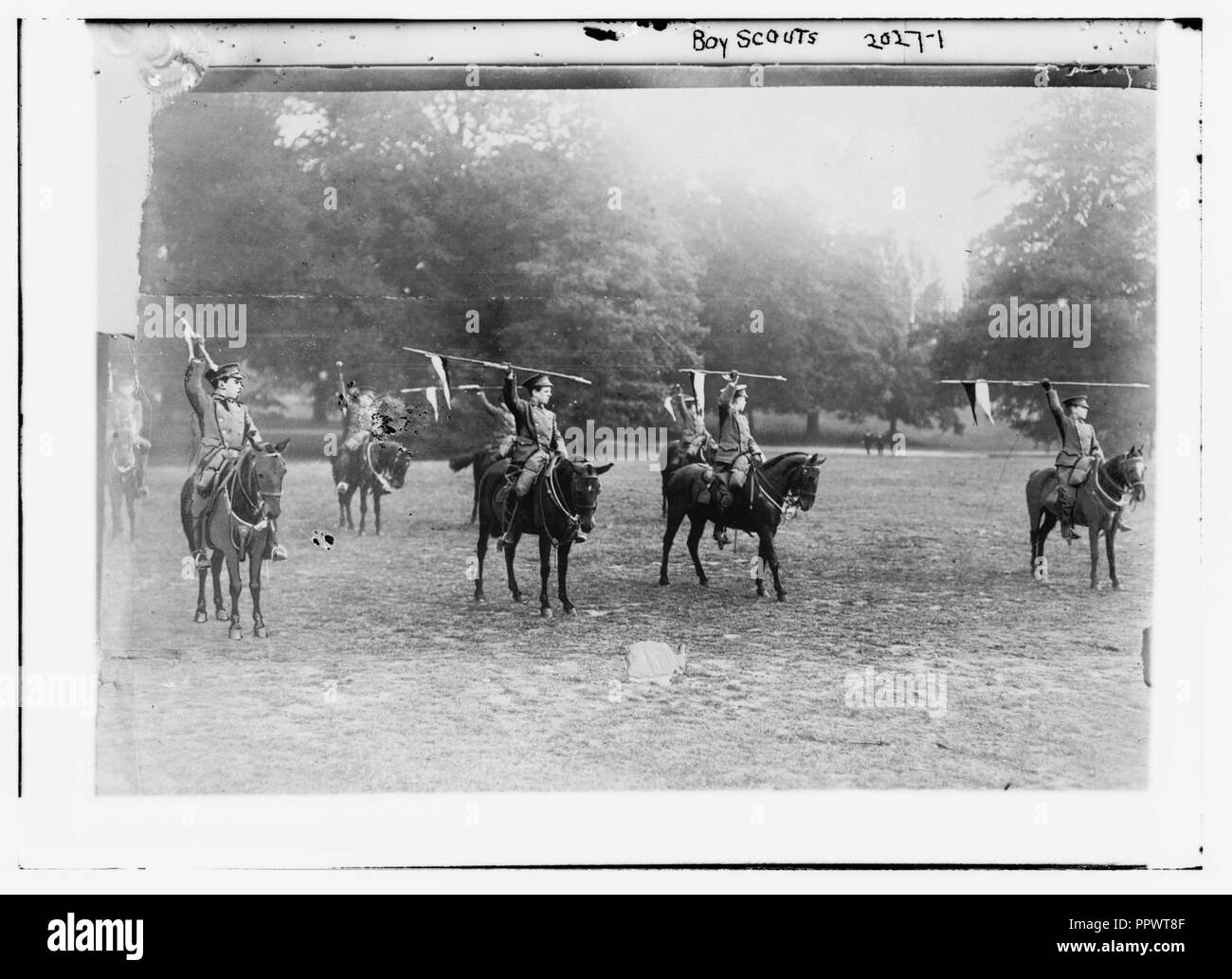 Boy Scouts. On Horseback with spears held aloft. Stock Photo