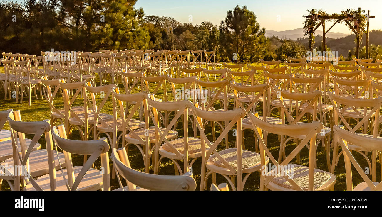 Rows and columns of chairs facing a Chuppah Stock Photo Alamy