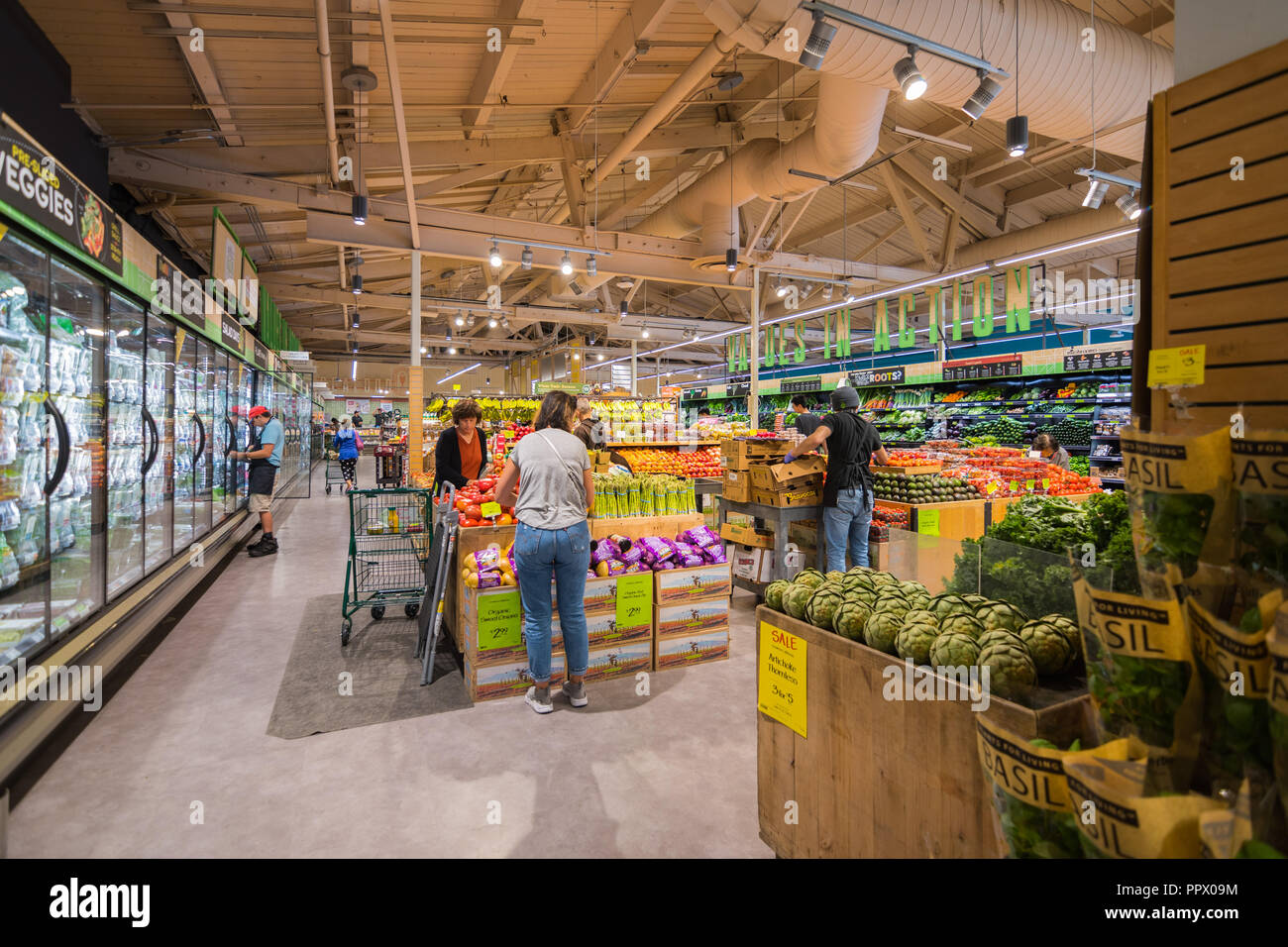 September 27, 2018 Palo Alto / CA / USA - People shopping at Whole Foods in the fruits and vegetables section, south San Francisco bay area Stock Photo