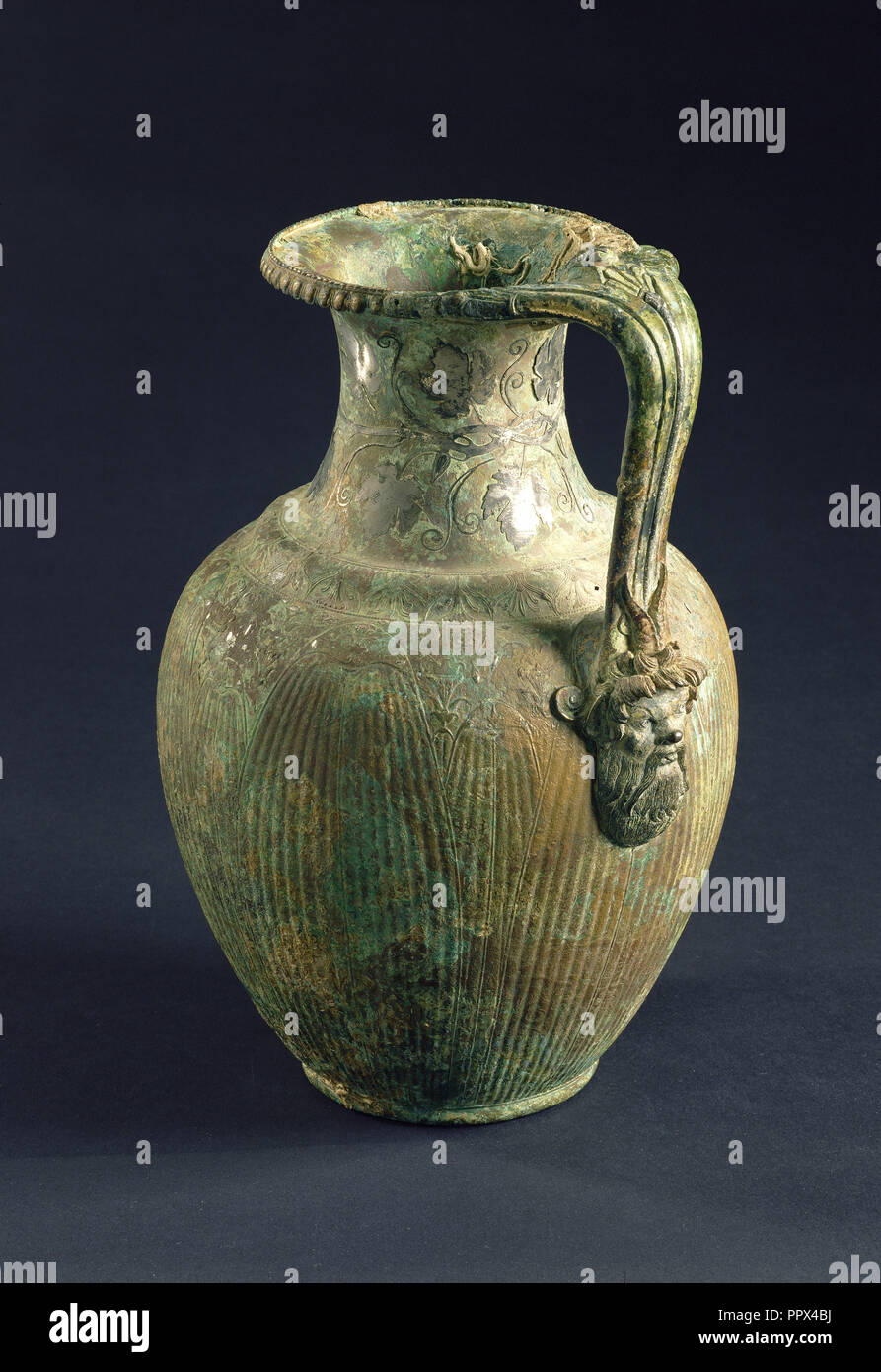 Pitcher with Bacchic Imagery; Alexandria, Egypt; 25 B.C. - A.D. 25; Bronze and silver; 32 × 22 × 20.3 cm Stock Photo