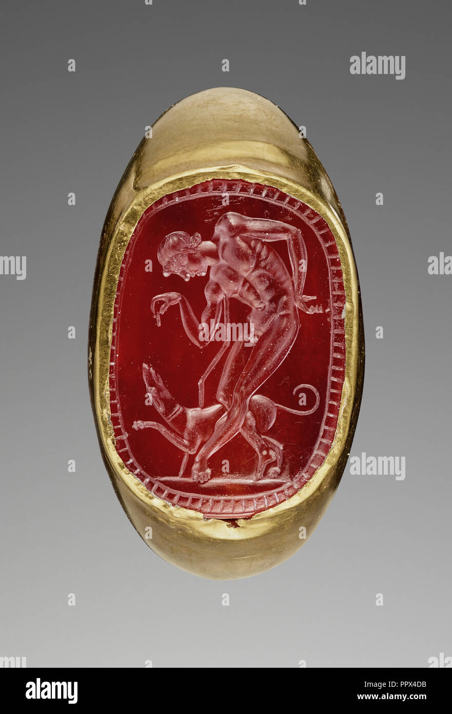 Youth and Dog; Italy; 3rd - 2nd century B.C; Gold; carnelian; 1.8 × 1.3 cm, 11,16 × 1,2 in Stock Photo