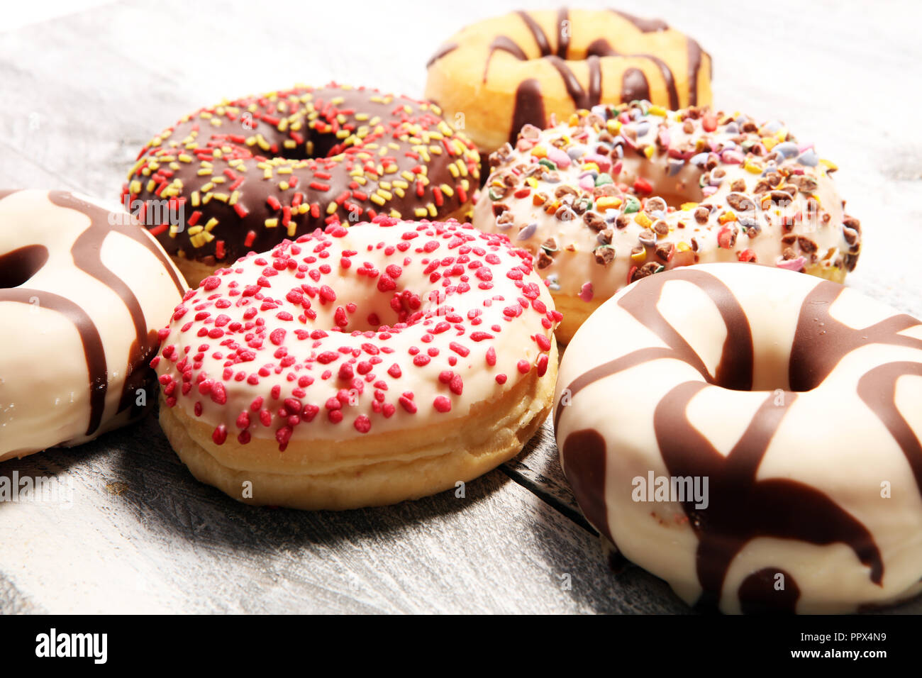 assorted donuts with chocolate frosted, pink glazed and sprinkles ...