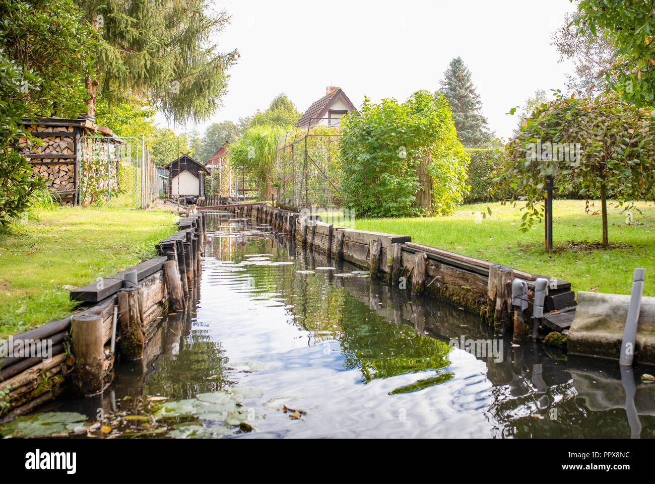 Lehde, Spreewald / Germany.  Typical Spreewald landscape. Canals, vivid plants and wooden architecture. Stock Photo
